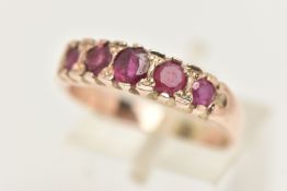 A FIVE STONE RUBY RING, five circular cut rubies prong set in yellow metal leading on to a plain