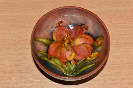 A MOORCROFT POTTERY 'FREESIA' PATTERN FOOTED BOWL, diameter 8cm, a coral and yellow freesia on a - Image 3 of 4