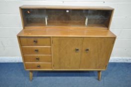 A MID CENTURY TEAK SIDEBOARD, the raised back with a glass sliding door, that's enclosing two