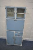 A 20TH CENTURY PAINTED KITCHEN CABINET, fitted with double glazed doors, the left door depicting a