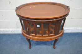 A LATE 20TH CENTURY MAHOGANY DRINKS CABINET, with a removable tray, a single door, raised on
