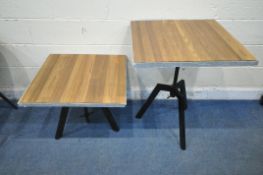 A PAIR OF HEIGHT ADJUSTABLE SWIVEL TABLES, 71cm squared x maximum height 86cm x minimum height