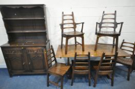A 20TH CENTURY OAK RECTANGULAR DINING TABLE, raised on trestle legs, united by a stretcher, length