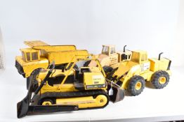 FOUR UNBOXED PLAYWORN MIGHTY TONKA TOYS CONSTRUCTION VEHICLES, c.1970's and later, two articulated