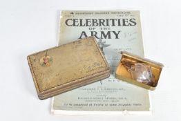 A WWI PRINCESS MARY TIN, various cap badges, a French medal and a souvenir book from the Boer War,