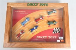 A REPRODUCTION DINKY TOYS WORLD FAMOUS RACING CARS COUNTER TOP DISPLAY, with the six correct