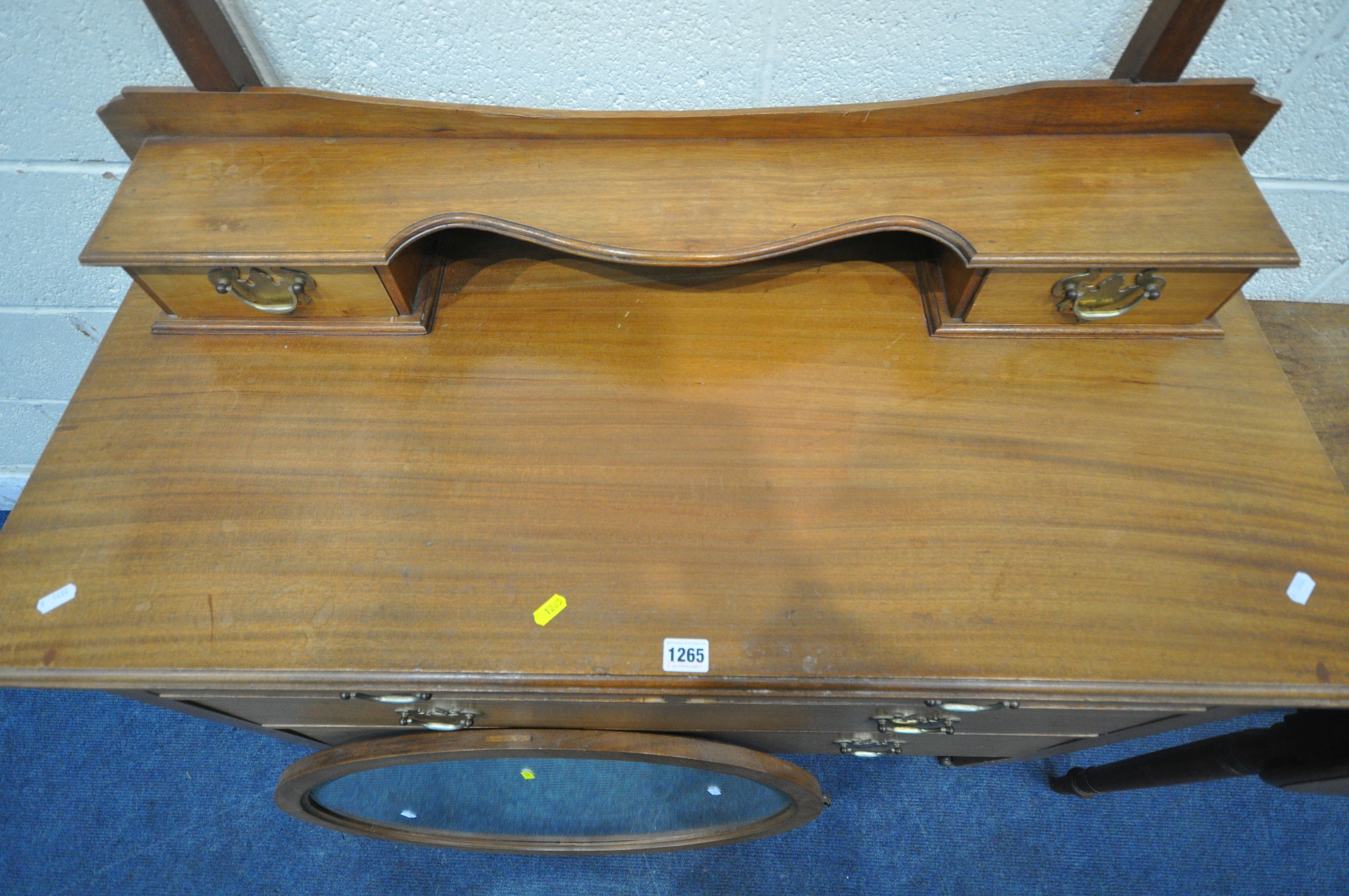 A 20TH CENTURY MAHOGANY DRESSING TABLE, with a bevelled edge oval mirror, an arrangement of six - Image 4 of 5