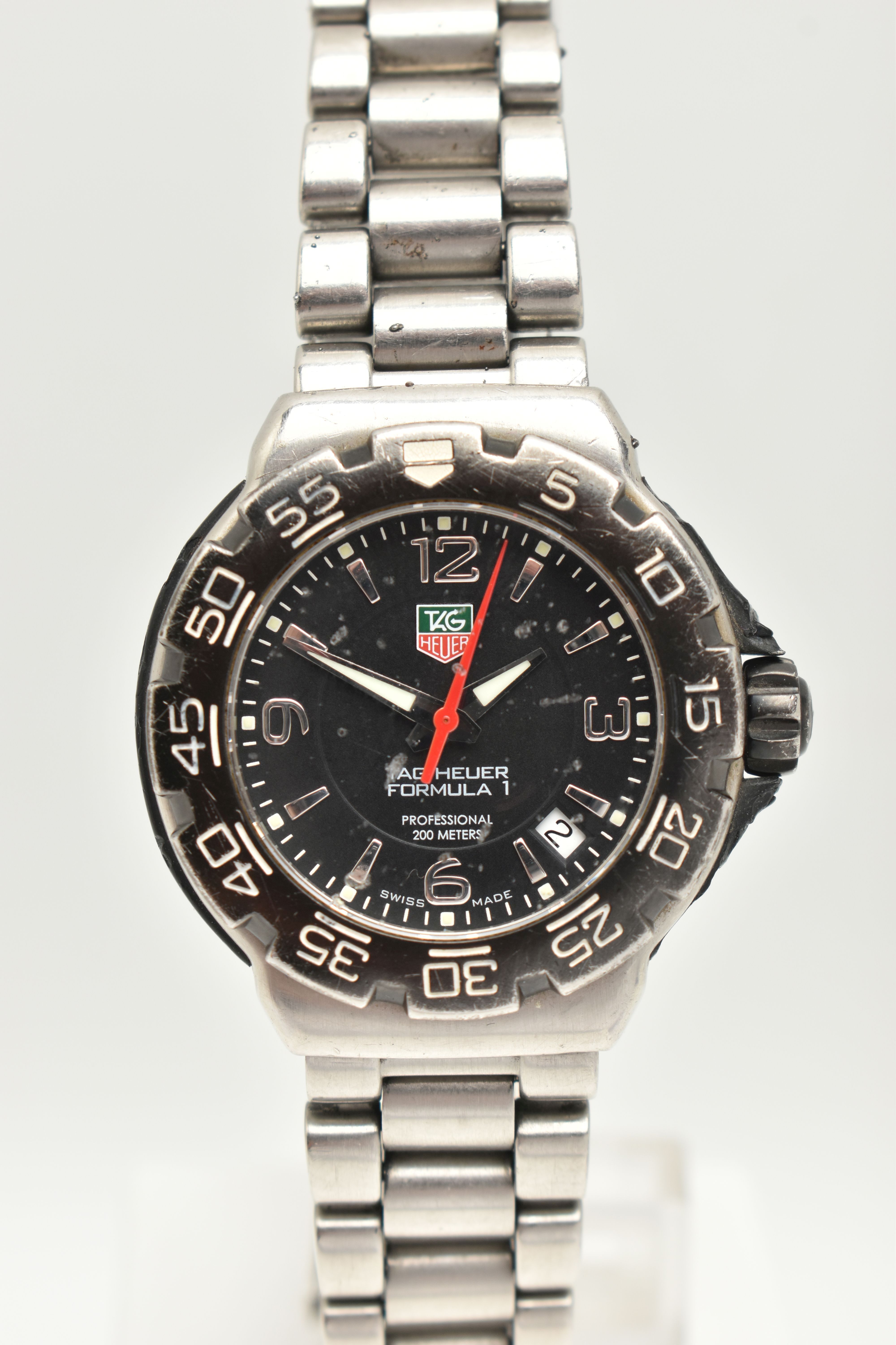 A 'TAG HEUER' FORMULA 1 WRISTWATCH, quartz movement, round black dial signed 'Tag Heuer', baton