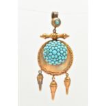 A VICTORIAN PENDANT, a yellow metal circular form pendant, set with a dome of turquoise stones,