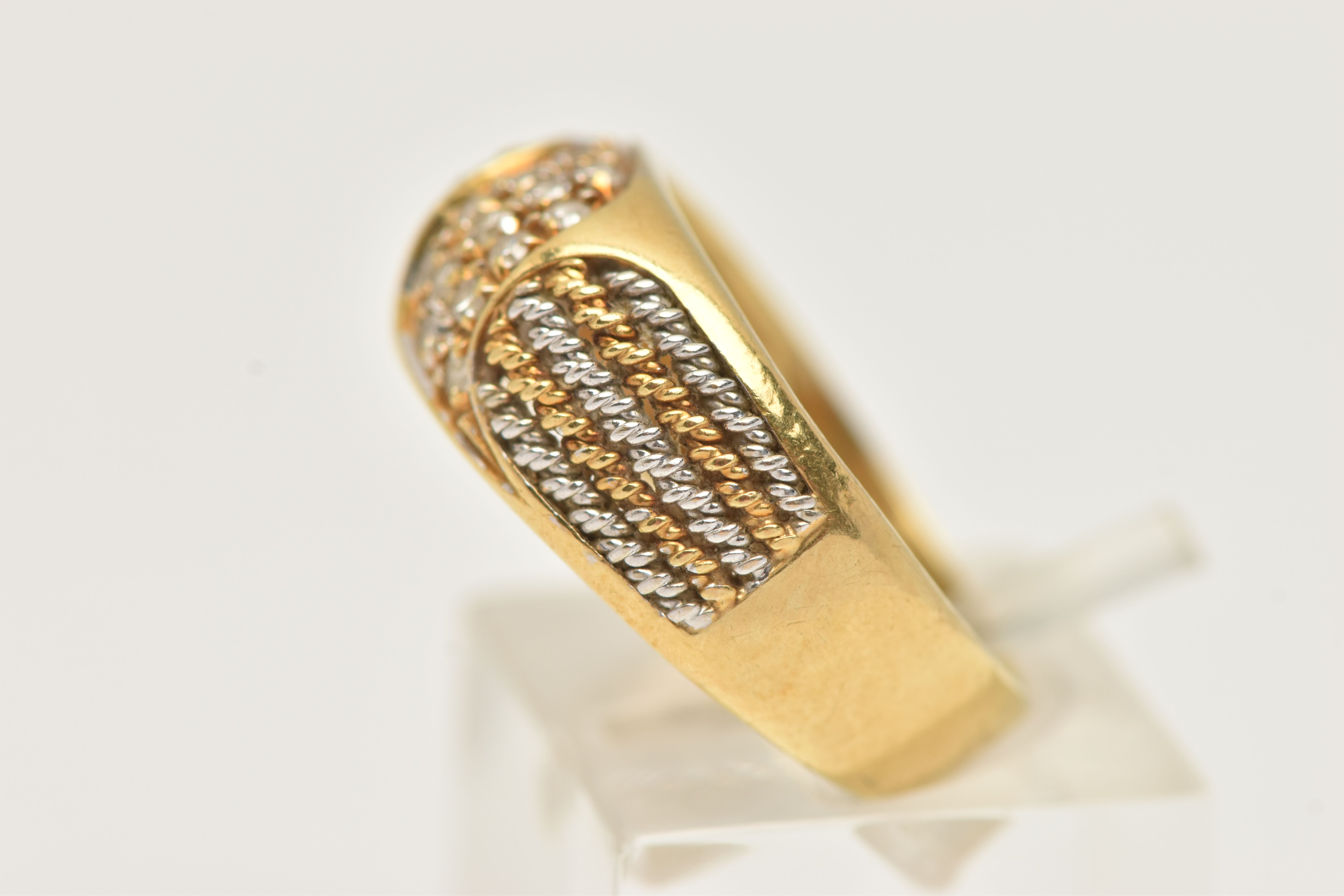 A YELLOW METAL DIAMOND RING, pave set with a row of single cut diamonds, flanked with bi-colour wire - Image 2 of 4