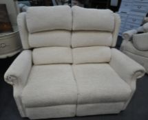 A BEIGE UPHOLSTERED TWO SEATER SOFA, length 135cm (condition report: overall good condition)
