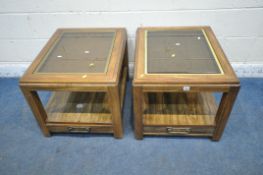 A PAIR OF HARDWOOD RECTANGULAR LAMP TABLES, with a glass insert, the undershelf fitted with a single