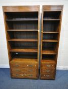 HENREDON, A LARGE SOLID OAK CABINET, with four shelves, above three drawers with brass campaign