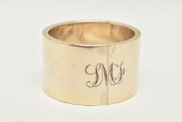 A GEORGE V SILVER NAPKIN RING, a heavy plain napkin ring with monogram engraved detail,