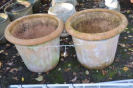 A PAIR OF LARGE TERRACOTTA COLOURED PLANT POTS, stamped to side, 'handmade Esteras Terraneo Greece',