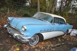 A 1956 BUICK RIVIERA FOUR DOOR COUPE CAR, in blue and white with matching vinyl interior, a