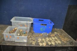 FOUR TRAYS CONTAINING FURNITURE ADORNMENTS, including early 20th century and earlier Ormolu and