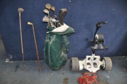 A VINTAGE GOLF BAG , ELECTRIC TROLLEY AND CLUBS including a hickory shafted 'Mashie' and wood, other