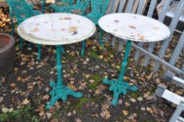 A PAIR OF VICTORIAN STYLE CAST IRON PUB TABLES with a tripod base and a white marble top, 59cm in