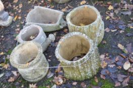 A COLLECTION OF WEATHERED COMPOSITE PLANTERS, two in the form of hollowed out tree stumps 29cm high,