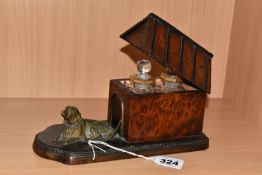 A NINETEENTH CENTURY AMBOYNA BOX IN THE FORM OF A KENNEL, with ebonised details and hinged cover,