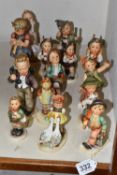 A GROUP OF FIFTEEN HUMMEL FIGURES BY W. GOEBEL to include 'Merry Wanderer' 112/09, 'Goose Girl'