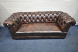 A BROWN LEATHER CHESTERFIELD DROP END SOFA, with buttoned backrest and armrests, length 203cm x