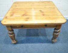 A 19TH CENTURY PINE FARMHOUSE TABLE, with canted corners, a single frieze drawer, raised on