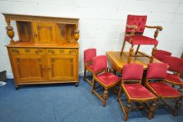 A 20TH CENTURY OAK DRAW LEAF DINING TABLE, raised on carved bulbous supports, shaped feet, united by