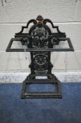 A BLACK PAINTED CAST IRON STICK / UMBRELLA STAND, with scrolled and foliate details, width 42cm x