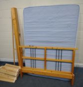 A MODERN PINE 5FT BEDSTEAD, with a blue mattress (condition report: siderails, slats, bolts,