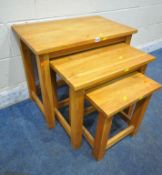 A SOLID OAK NEST OF THREE TABLES, largest table width 70cm x 43cm x height 60cm (condition report: