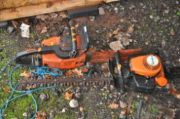 A STIHL 010AV PETROL CHAINSAW along with a Tanaka THT-210 petrol hedge trimmer (both engines pulls