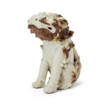 A Japanese white-glazed model of a Shishi Edo period, late 17th century The seated dog with its...