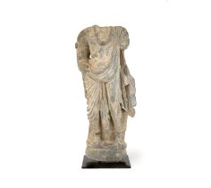 A fragmentary light grey schist standing figure of a bodhisattva, possibly Maitreya, ancient regi...