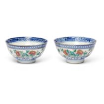 A pair of famille rose and blue and white 'floral' bowls Republic period, Guan yao nei zao marks...