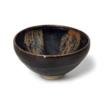 A Chinese black-glazed russet-splashed bowl Northern Song/Jin dynasty Covered in a lustrous, th...