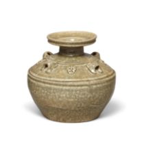 A Chinese Yueyao celadon-glazed 'taotie' jar Western Jin dynasty With trumpet mouth above a sho...