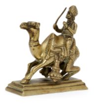 A brass figure of a camel rider, India, circa 1800 or later, on a rectangular tiered base, the ca...