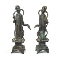 A pair of Chinese bronze figures of celestial ladies Song dynasty Each standing on a square pli...