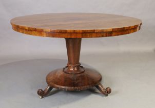 A Regency rosewood breakfast table, first quarter 19th century, the circular tilt top above taper...