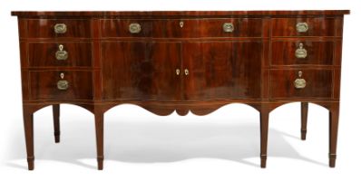 A George III mahogany serpentine front sideboard, possibly Irish, last quarter 18th century, with...