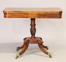 A Regency inlaid rosewood card table, first quarter 19th century, the hinged swivel top revealing...