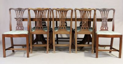An English mahogany dining table, George III style, 20th century, with one extra leaf, stamped 38...