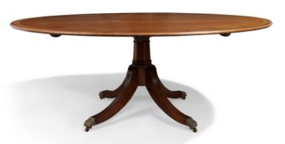 An English mahogany circular dining table by Arthur Brett, George III style, 20th century, the cr...