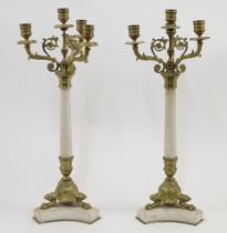 A pair of gilt-metal and resin four-light candelabra, 20th century, the column and base with marb...