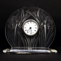 A Lalique clear and frosted ‘Iris’ timepiece, c.2003, etched Lalique ® France to integral ellipti...