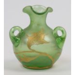 An Art Nouveau style green glass vase, 20th century, modelled with three handles and painted in g...