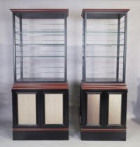 Two modern bespoke made ebonised cabinets, 230cm high, 100cm wide, 49cm deep (largest), 230cm hig...