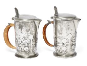 Archibald Knox (1864-1933) for Liberty & Co.   Two 'Tudric' hot water jugs, circa 1900  Pewter, ...